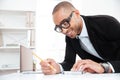 Close-up portrait of a businessman making notes at documents Royalty Free Stock Photo