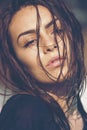 Close-up portrait of carefree young woman with wet hair enjoying summer sun