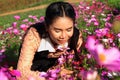 Close up portrait,caucasian woman and expression happiness,pretty girl with pink cosmos flowers Royalty Free Stock Photo