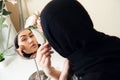 Close-up portrait of charming Muslim woman wearing makeup. do face Royalty Free Stock Photo