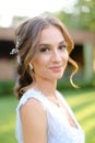 Close up portrait of charming nice bride outdoors.