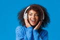 Close-up portrait cheeky and carefree happy smiling african-american modern gen-z girl with afro haircut, curly hair