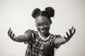 Close up portrait of cheerful African female showing kindness and politeness