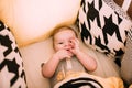 Close-up portrait of a cheerful cute baby in the crib at home Royalty Free Stock Photo