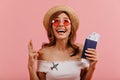 Close-up portrait of cheerful happy girl, crossed her fingers and looking enthusiastically upwards. Travel blogger in Royalty Free Stock Photo