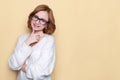 Close up portrait of cheerful satisfied successful woman with short hair wears glasses, white oversize sweater, poses, smiling, lo Royalty Free Stock Photo