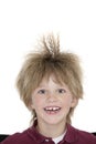 Close-up portrait of a cheerful school boy with spiked hair over colored background Royalty Free Stock Photo