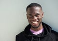 Close up portrait of a cheerful young black man smiling