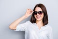 Close up portrait of chic posh classy girlish cute beautiful attractive charming gorgeous girl wearing brown glasses dressed in l Royalty Free Stock Photo