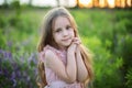 Close-up portrait child praying. Little girl hand praying, hands folded in prayer concept for faith, spirituality and religion. Cu