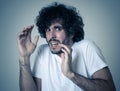 Close up portrait of concern shocked young man with frightened gestures. Scared facial expression Royalty Free Stock Photo