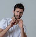 Close up portrait of concern shocked young man with frightened gestures. Scared facial expression Royalty Free Stock Photo