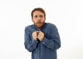 Close up portrait of concern shocked young man with frightened gestures. Scared facial expression Royalty Free Stock Photo