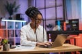 Close up portrait of confident african american financial expert office worker sitting at table Royalty Free Stock Photo