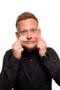 Close up portrait of a confident, blond, handsome young man wearing black shirt, isolated on white background Royalty Free Stock Photo