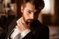 Close up portrait of confident businessman has thick ginger beard and mustache, dressed formally, being self assured in