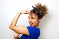 Close up cool young african american woman flexing bicep muscle