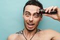 Close up portrait of a crazy middle aged shirtless man Royalty Free Stock Photo
