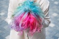 Close-up portrait of curly Caucasian woman with multi-colored hair. Model for hairstyles