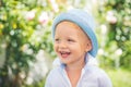 Close up portrait of cute boy smiling outdoors. Closeup headshot portrait of launching little boy on nature background Royalty Free Stock Photo