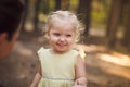 Close-up portrait of cute cheerful little girl in park Royalty Free Stock Photo