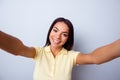 Close up portrait of cute excited latin girl making selfie with Royalty Free Stock Photo