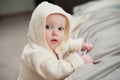 Close up portrait of cute funny baby in bathrobe. Royalty Free Stock Photo