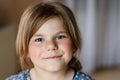 Close-up portrait of a cute little girl. Happy smiling preschool child looking at the camera. Childhood concept. Royalty Free Stock Photo