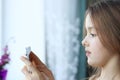 Close up portrait of cute little girl looking at screen of digital tablet or phone with scared surprised face Royalty Free Stock Photo