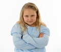 Pretty little girl with a angry facial expression looking mad at the camera. Human emotions Royalty Free Stock Photo