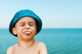 Close-up portrait of a cute, smiling young child at the beach. People, travel, holidays and tourism concept. Royalty Free Stock Photo