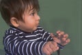 Close up portrait of cute Sweet little baby looking happy wonder and feeling surprised about something unfamiliar. Indian