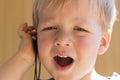 Close-up portrait of cute toddler boy with ear-phones listening music Royalty Free Stock Photo