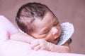 Cute two weeks old newborn baby girl sleeping peacefully Royalty Free Stock Photo