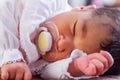 Close up portrait of a cute two weeks old newborn baby girl