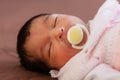 Close up portrait of a cute two weeks old newborn baby girl Royalty Free Stock Photo