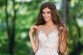 Close up portrait of cute young bride with long hairs dressed in beautiful white marriage dress. Pretty girl on greet Royalty Free Stock Photo