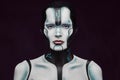 Sensual cyber woman with creative make-up. Technology and future concept. Isolated on a dark textured background. Royalty Free Stock Photo