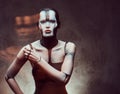Sensual cyber woman with creative make-up. Technology and future concept. Isolated on a dark textured background. Royalty Free Stock Photo