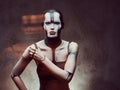 Sensual cyber woman with creative make-up. Technology and future concept. Isolated on a dark textured background.