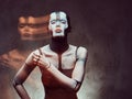 Sensual cyber woman with creative make-up. Technology and future concept. Isolated on a dark textured background. Royalty Free Stock Photo