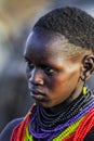 Close up Portrait of Dassanech Tribe Woman with Traditional Bright Necklace and Hairstyle