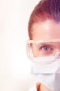 Close-up portrait of dentist wearing surgical mask and eyewear at clinic