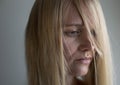 Close up portrait of depressed blond woman