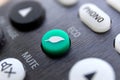 A close up portrait of an eco button on a remote control to turn a device into its ecologic environment friendly and power saving
