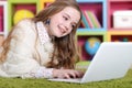 Close up portrait of emotional cute girl using laptop Royalty Free Stock Photo