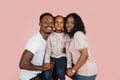 Close up portrait of excited african american man, woman and girl laughing and posing Royalty Free Stock Photo