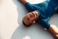 Close up portrait of a exhausted young african fitness man