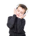Close up portrait of eyes closed boy listening to music with headphones Royalty Free Stock Photo