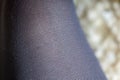 A close up portrait of the fabric and texture of the fabric or material of black nylon pantyhose, stockings, hosiery or tights Royalty Free Stock Photo